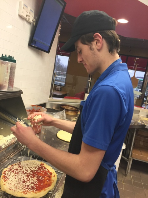 Student working at Domino's